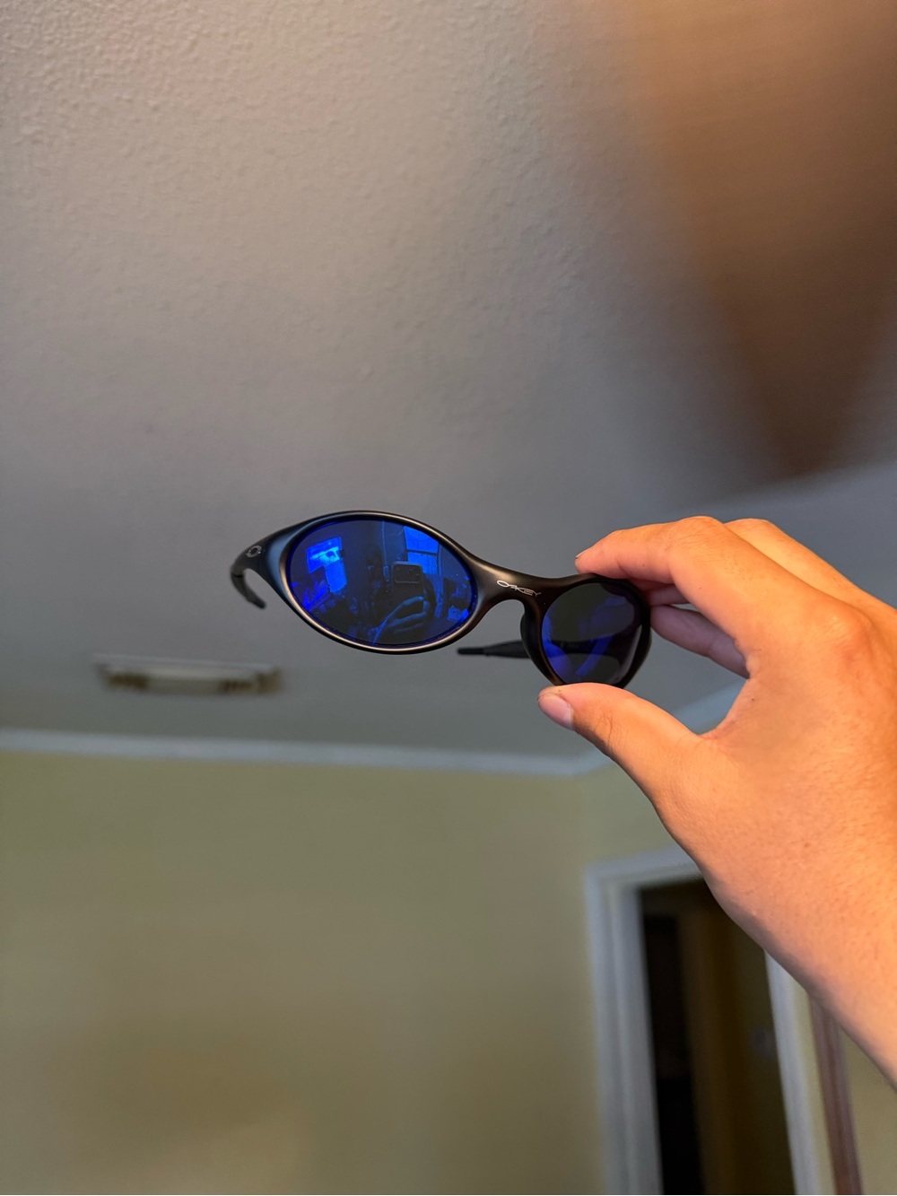 Black Oval Sunglasses with Blue Mirrored Lenses Oakley Oakleys